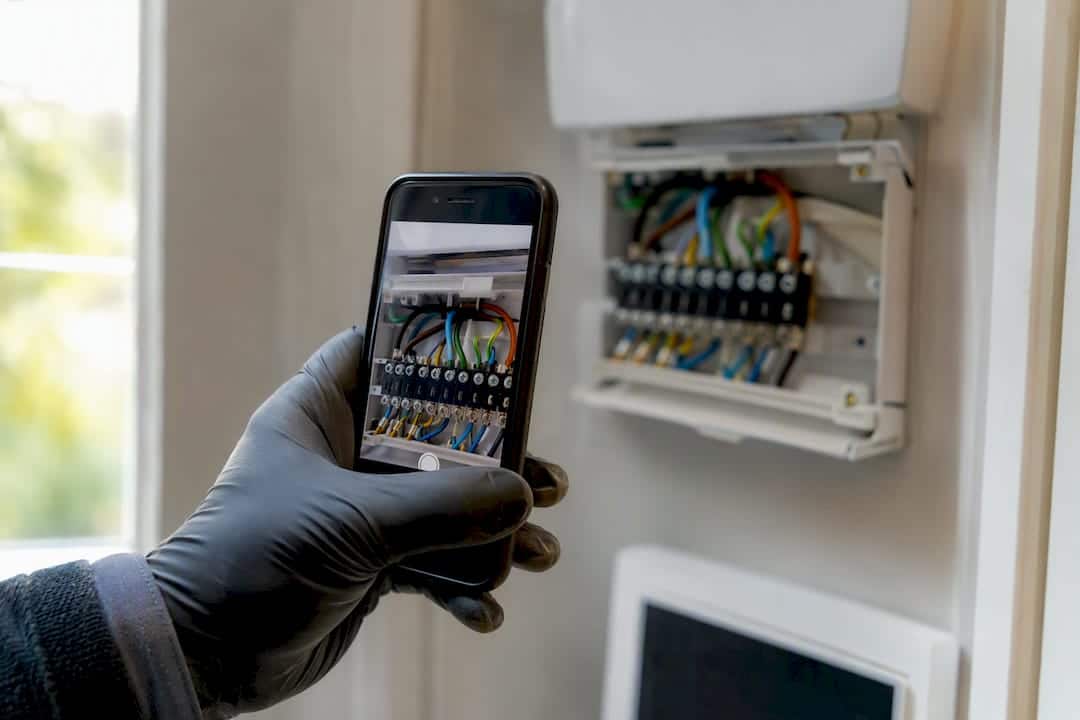 Photographing thermostat wiring terminals